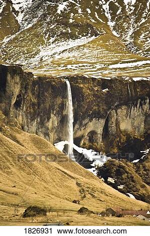 Stock Image - Waterfall near Town of Vik, Southern Iceland . Fotosearch