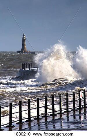 Waves crashing by lighthouse at Sunderland, Tyne and Wear, England View Large Photo Image Stock Image - Waves crashing by lighthouse at Sunderland, Tyne and Wear, England. Fotosearch
