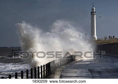 Waves crashing by lighthouse at Sunderland, Tyne and Wear, England View Large Photo Image Stock Photo - Waves crashing by lighthouse at Sunderland, Tyne and Wear, England. Fotosearch