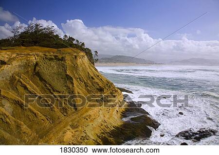 Stock Image - Waves crashing, Cape Kiwanda, Oregon, USA. Fotosearch