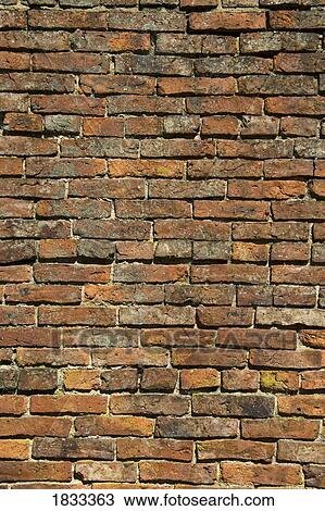 Stock Image - Weathered brick wall. Fotosearch