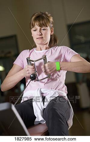 Stock Photography - Woman at the gym. Fotosearch