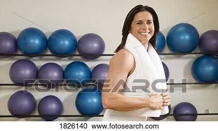 Woman in gym View Large Photo Image Stock Image - Woman in gym. Fotosearch