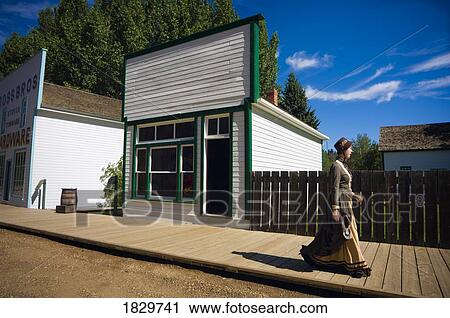 Woman in old-fashioned dress walking by pioneer shop, Fort Edmonton, Alberta, Canada View Large Photo Image Stock Image - Woman in old-fashioned dress walking by pioneer shop, Fort Edmonton, Alberta, Canada. Fotosearch