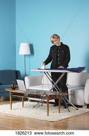 Woman ironing View Large Photo Image Stock Image - Woman ironing. Fotosearch
