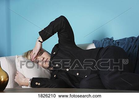 Woman laying down and resting View Large Photo Image Stock Image - Woman laying down and resting. Fotosearch