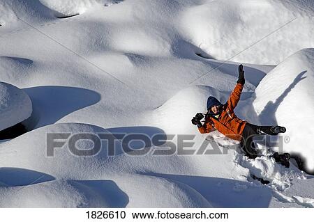 Woman lying in the snow, Jasper National Park, Alberta, Canada View Large Photo Image Stock Image - Woman lying in the snow, Jasper National Park, Alberta, Canada. Fotosearch