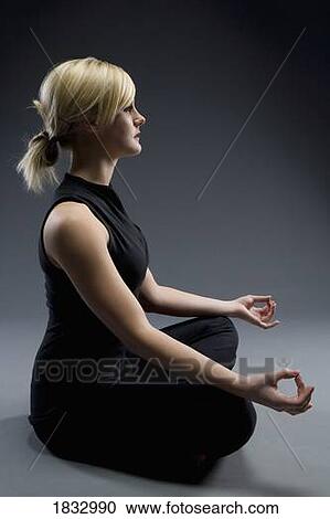Woman meditating View Large Photo Image Stock Image - Woman meditating. Fotosearch