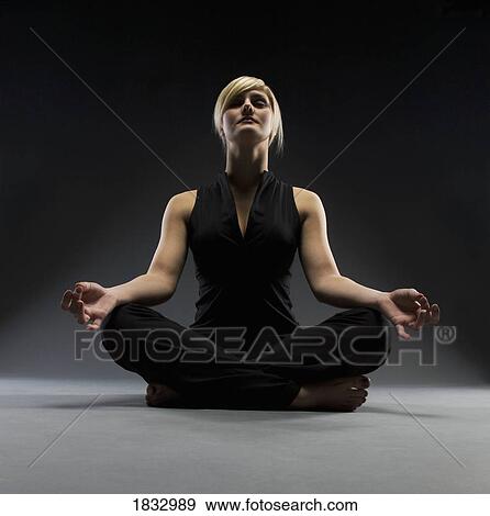 Woman meditating View Large Photo Image Stock Photo - Woman meditating. Fotosearch