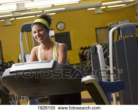 Woman on the treadmill View Large Photo Image Stock Photography - Woman on the treadmill. Fotosearch