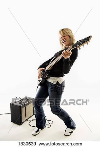 Woman playing guitar View Large Photo Image Stock Photo - Woman playing guitar. Fotosearch
