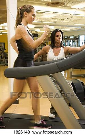 Stock Photo - Woman running on the treadmill. Fotosearch