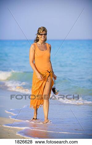 Woman walking on the beach, Playa del Carmen, Mayan Riviera, Mexico View Large Photo Image Stock Photo - Woman walking on the beach, Playa del Carmen, Mayan Riviera, Mexico. Fotosearch