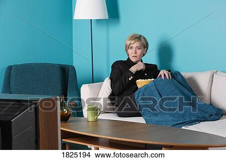 Woman watching television View Large Photo Image Picture - Woman watching television. Fotosearch