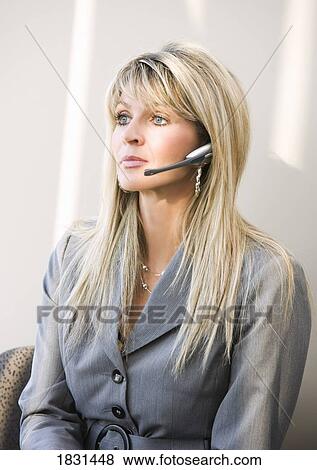 Woman with a head set View Large Photo Image Stock Photo - Woman with a head set. Fotosearch