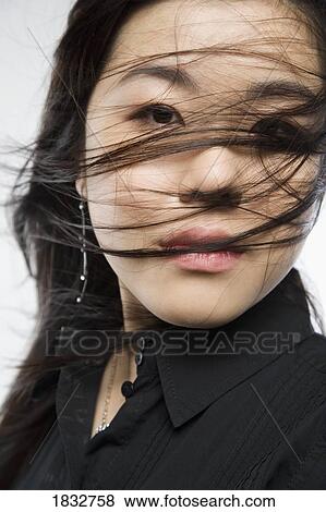 Stock Photo - Woman With Blowing Hair. Fotosearch
