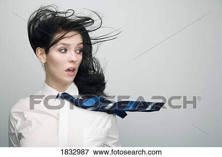 Stock Photo - Woman with wind blown hair. Fotosearch