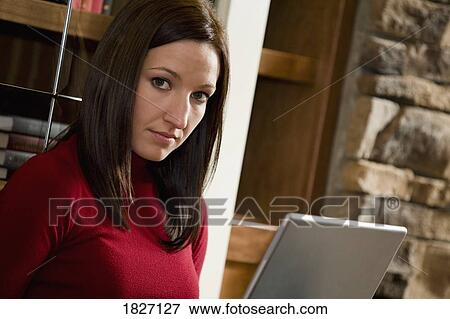 Stock Photo - Woman working on laptop. Fotosearch