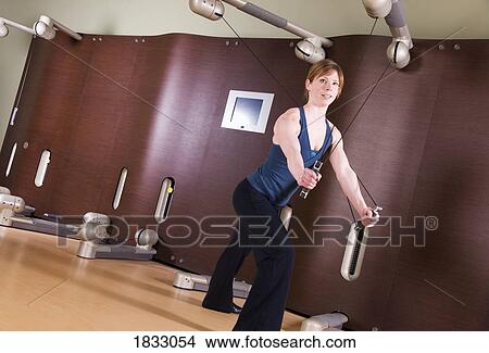 Picture - Woman working out. Fotosearch