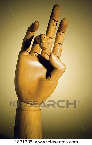 Stock Photography - Wooden mannequin hand with jointed fingers . Fotosearch