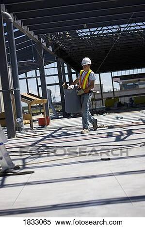 Worker at construction site View Large Photo Image Stock Photography - Worker at construction site. Fotosearch