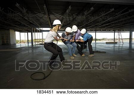 Stock Image - Workers fighting on the job site. Fotosearch