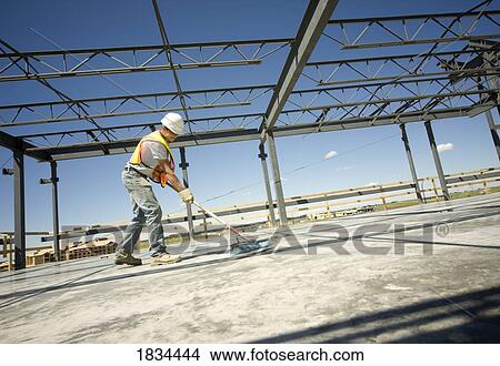 Picture - Working on a job site. Fotosearch