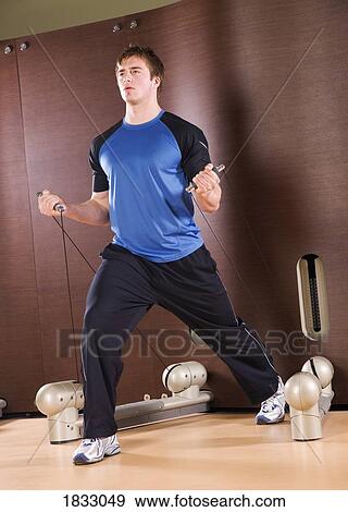 Stock Photo - Working out at home. Fotosearch