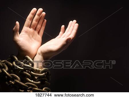 Picture - Worshipping with chains. Fotosearch