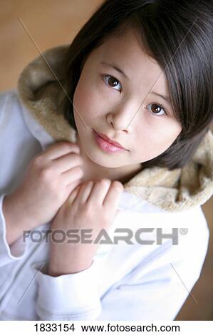 Picture - Young girl in white jacket. Fotosearch