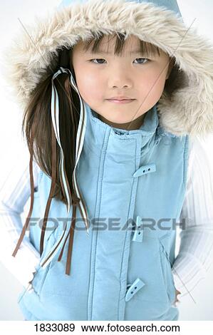 Stock Photo - Young girl in winter clothes. Fotosearch