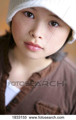 Stock Photography - Young girl with hat. Fotosearch