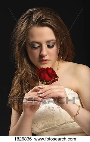 Young woman with rose View Large Photo Image Stock Photograph - Young woman with rose. Fotosearch