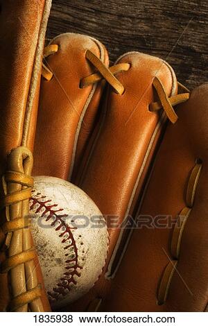 Stock Photo - Baseball glove and baseball. Fotosearch