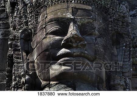 Stock Image - Bayon temple, Angkor, Cambodia; sculpted face. Fotosearch