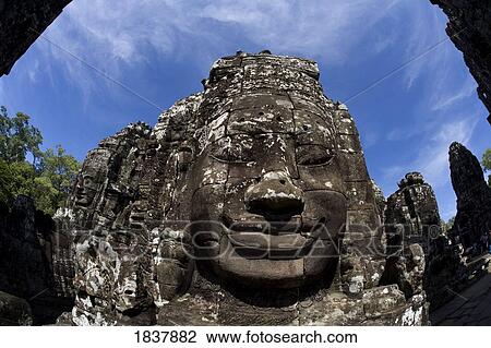 Stock Image - Bayon temple, Angkor, Cambodia; sculpted face. Fotosearch