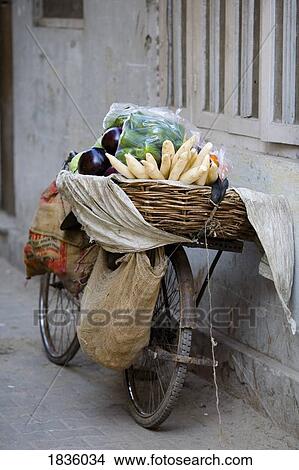 Picture - Bicycle loaded with food, Delhi, India. Fotosearch