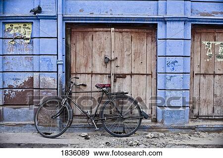Stock Photo - Bicycle outside building, Jodhpur, India . Fotosearch