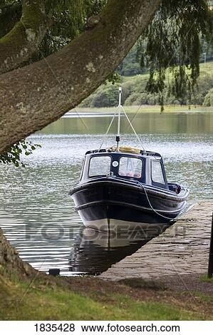 Boat by the shore View Large Photo Image Stock Photo - Boat by the shore. Fotosearch