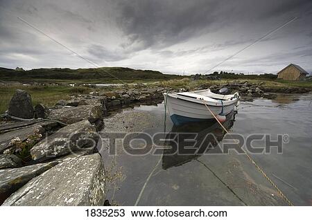 Stock Image - Boat tied to the shore. Fotosearch