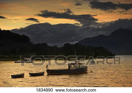 Boats at sunset, Scotland View Large Photo Image Stock Image - Boats at sunset, Scotland. Fotosearch