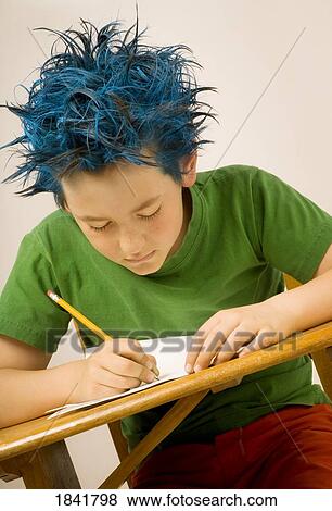 Stock Photo - Boy with blue spiked hair writing. Fotosearch