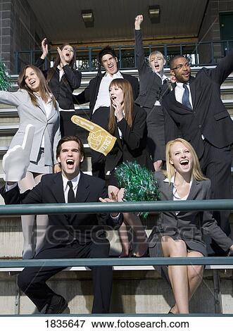 Business people cheering in the stands View Large Photo Image Stock Photo - Business people cheering in the stands. Fotosearch
