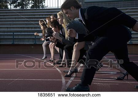 Stock Image - Business-people on a racetrack. Fotosearch