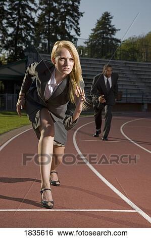 Business-woman and businessman on race track View Large Photo Image Stock Photograph - Business-woman and businessman on race track. Fotosearch