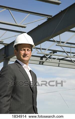Picture - Businessman in front of building. Fotosearch