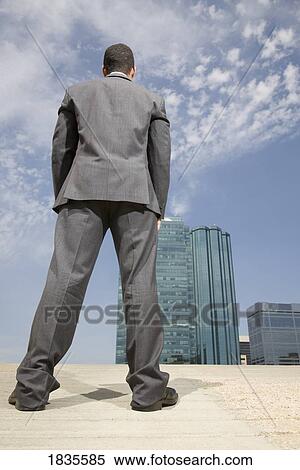 Businessman standing outside View Large Photo Image Stock Photography - Businessman standing outside. Fotosearch
