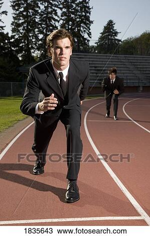 Stock Image - Businessmen on a racetrack. Fotosearch