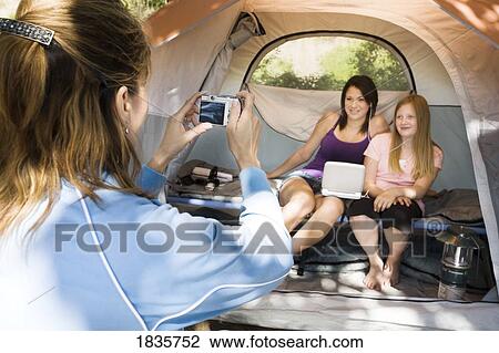 Stock Image - Camping together. Fotosearch