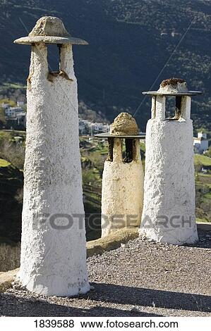 Stock Photo - Capileira, La Alpujarra, Granada Province, Spain, chimneys on flat roofs . Fotosearch